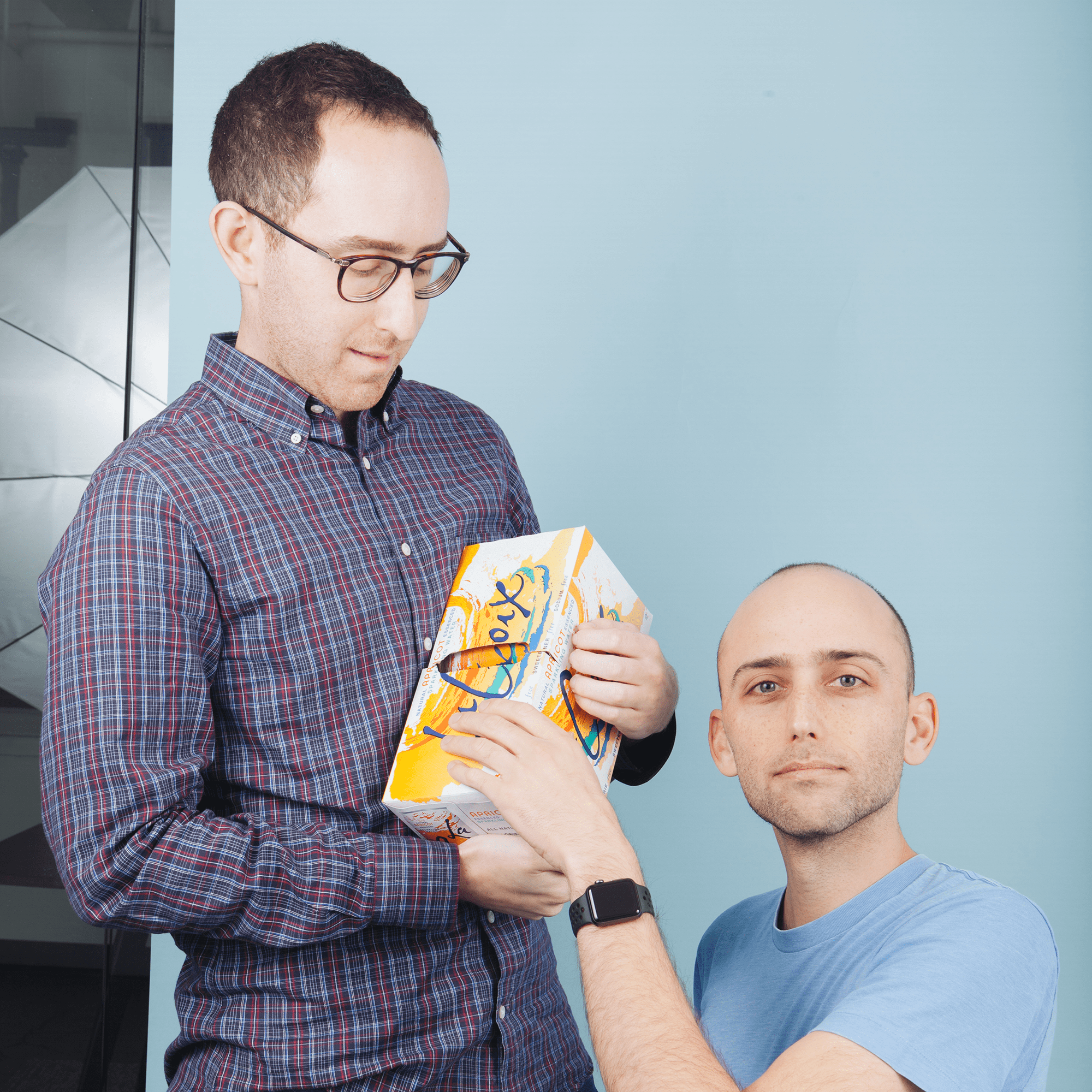 Alex & Kyle posing with a La Croix